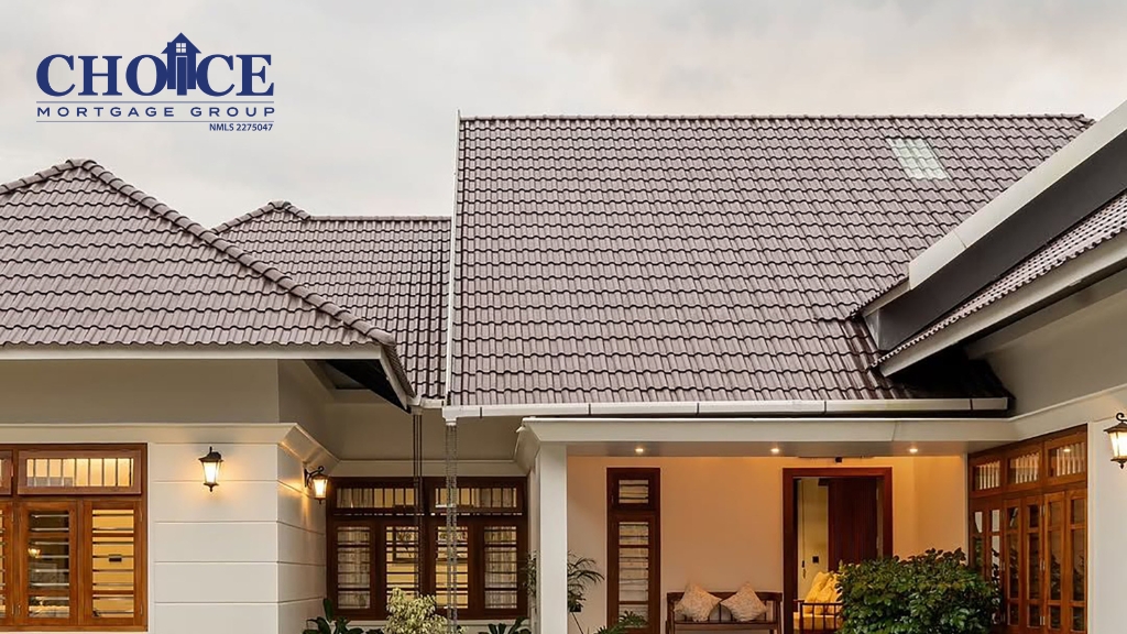 Image of a white house with wood features and brown roof at dusk